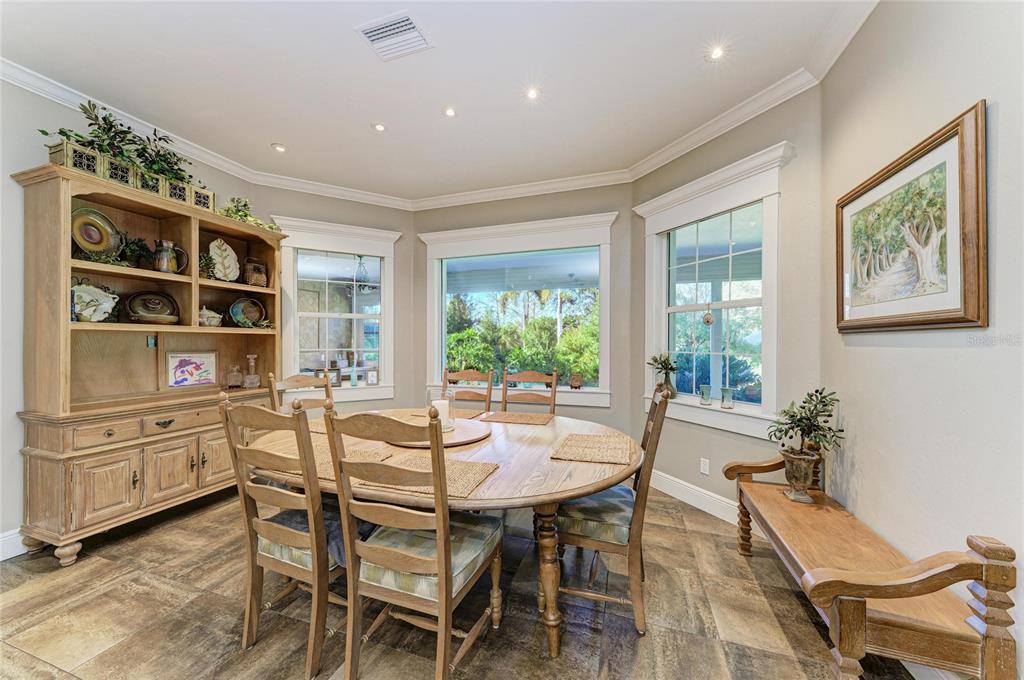 39321 Washington Loop Road Punta Gorda, FL 33982 - Photo 32 of 98 a view of a dining room with furniture and window