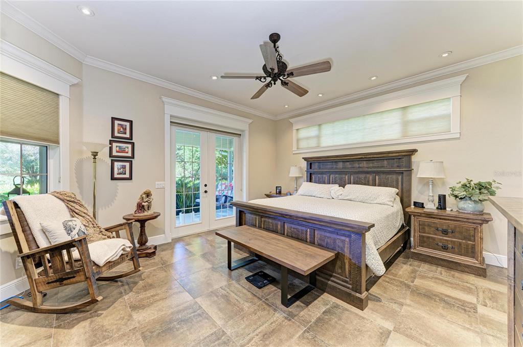 39321 Washington Loop Road Punta Gorda, FL 33982 - Photo 37 of 98 a bed room with a bed and a chair