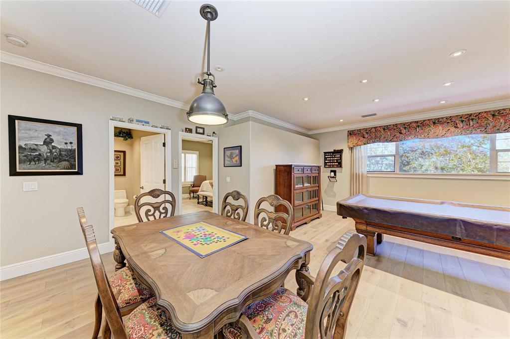 39321 Washington Loop Road Punta Gorda, FL 33982 - Photo 46 of 98 a view of a dining room with furniture window and wooden floor
