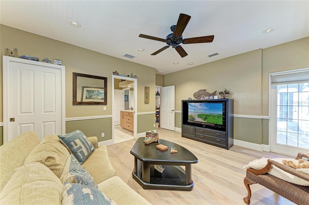 39321 Washington Loop Road Punta Gorda, FL 33982 - Photo 60 of 98 a living room with furniture and a flat screen tv