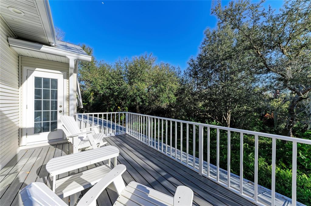 39321 Washington Loop Road Punta Gorda, FL 33982 - Photo 61 of 98 a view of balcony with wooden floor and outdoor seating