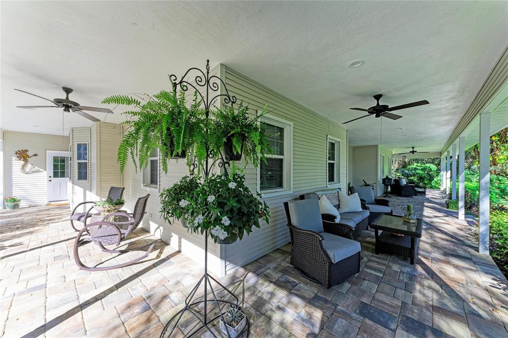 39321 Washington Loop Road Punta Gorda, FL 33982 - Photo 69 of 98 a living room with patio furniture and a potted plant