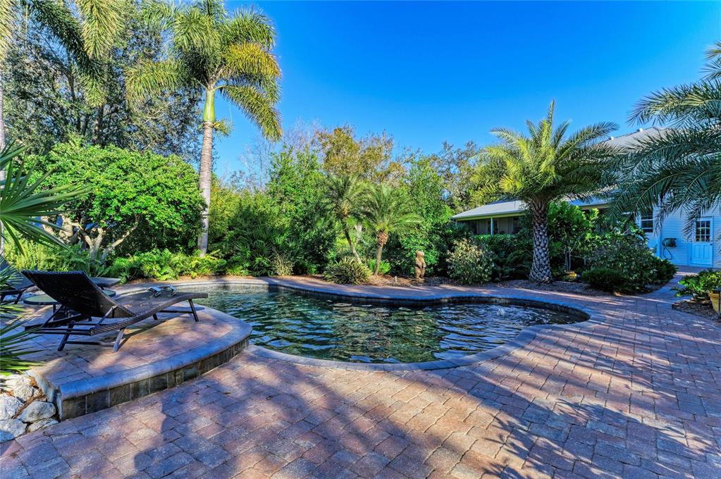39321 Washington Loop Road Punta Gorda, FL 33982 - Photo 75 of 98 a view of a backyard with plants and a patio