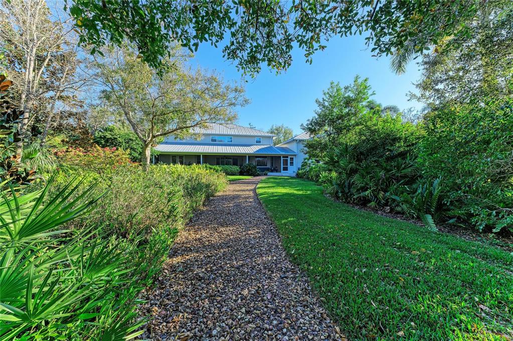 39321 Washington Loop Road Punta Gorda, FL 33982 - Photo 90 of 98 a view of house with swimming pool and garden