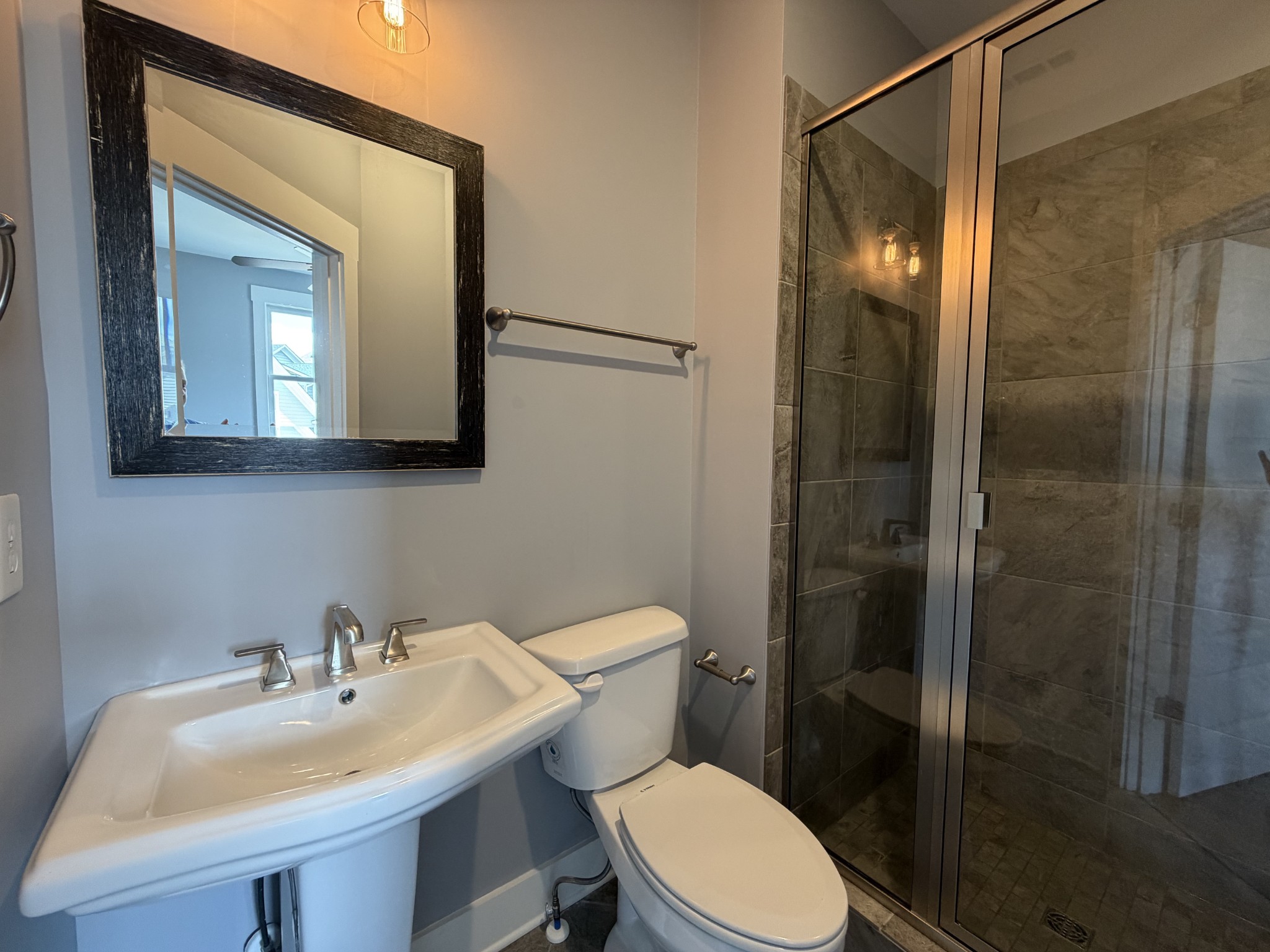 3097 Rural Plains Circle Franklin, TN 37064 - Photo 12 of 28 a bathroom with a toilet a sink and mirror
