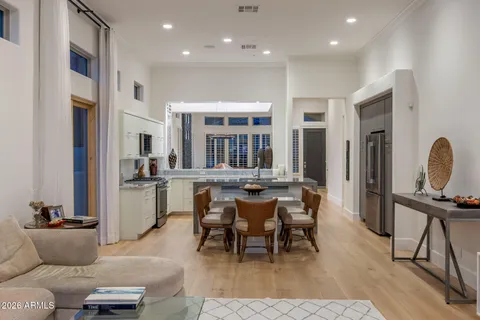 a view of a dining room with furniture and wooden floor