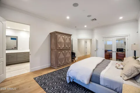 a bedroom with a bed and a couch