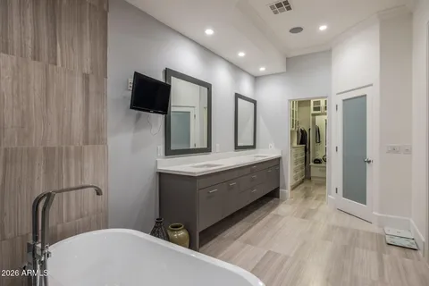 a bathroom with a sink a mirror and a toilet