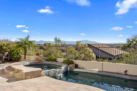 a view of a swimming pool with a patio
