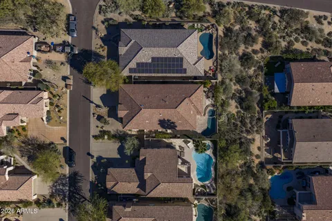 an aerial view of a house with a garden