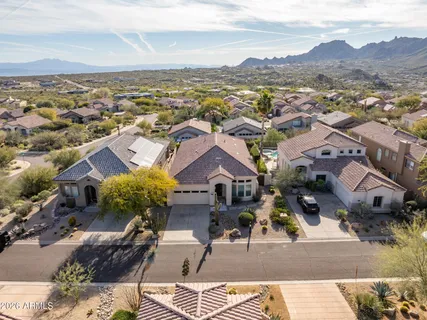 an aerial view of residential houses with outdoor space
