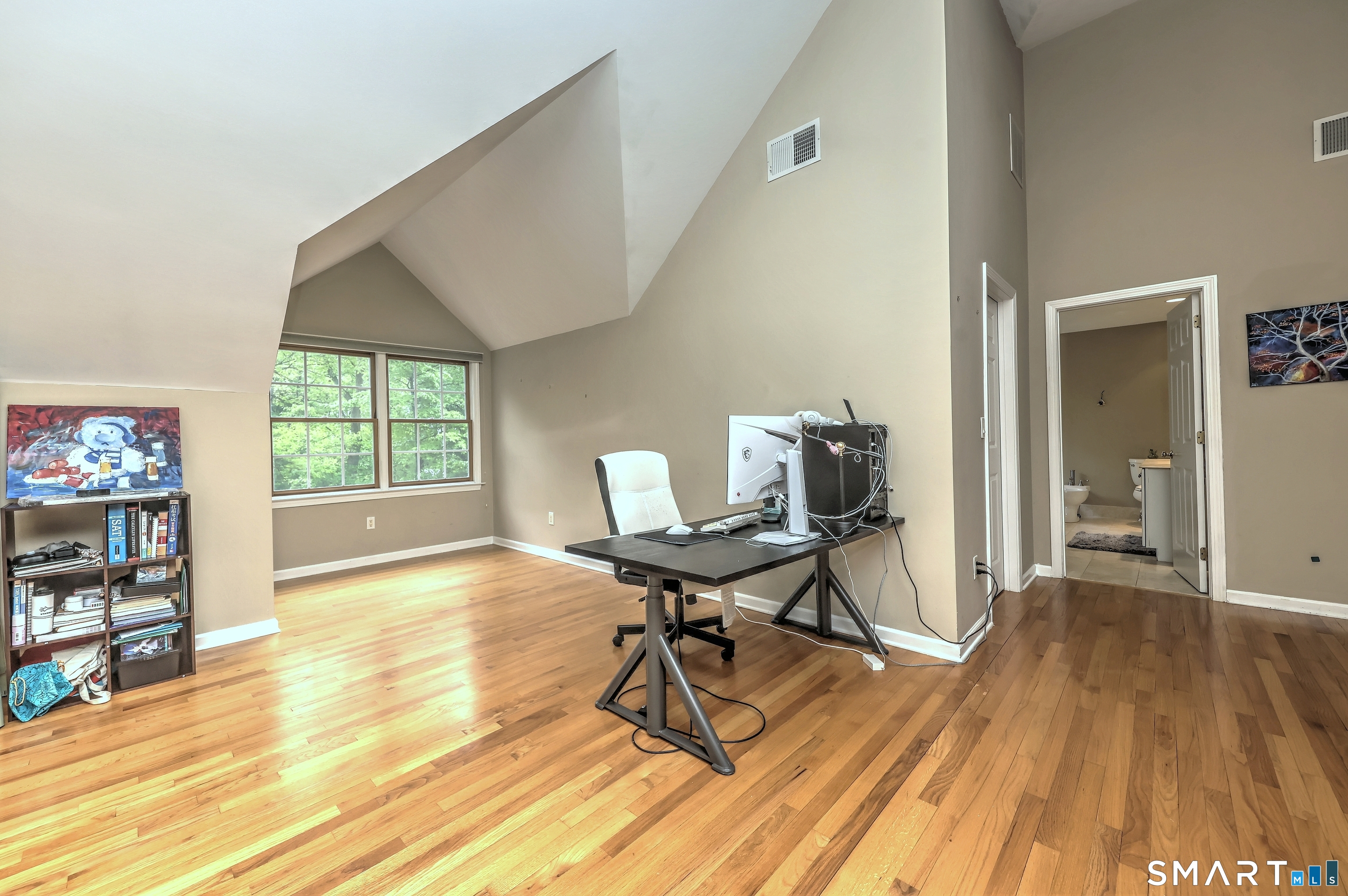 125 Peck Hill Road Woodbridge, CT 06525 - Photo 20 of 40 a workspace with furniture wooden floor and a window