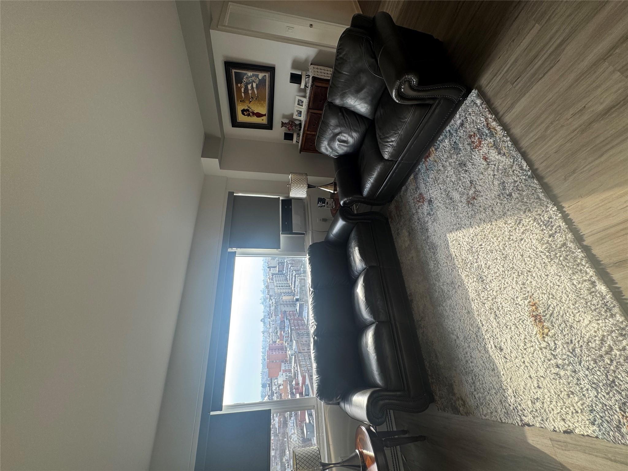 9 Fordham Hill Ovl, Unit 17C Bronx, NY 10468 - Photo 11 of 16 Living room with hardwood / wood-style flooring and a wealth of natural light