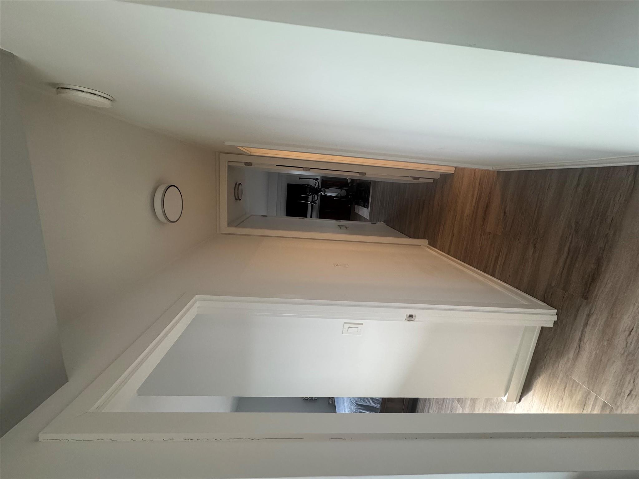 9 Fordham Hill Ovl, Unit 17C Bronx, NY 10468 - Photo 14 of 16 Corridor with dark wood-type flooring