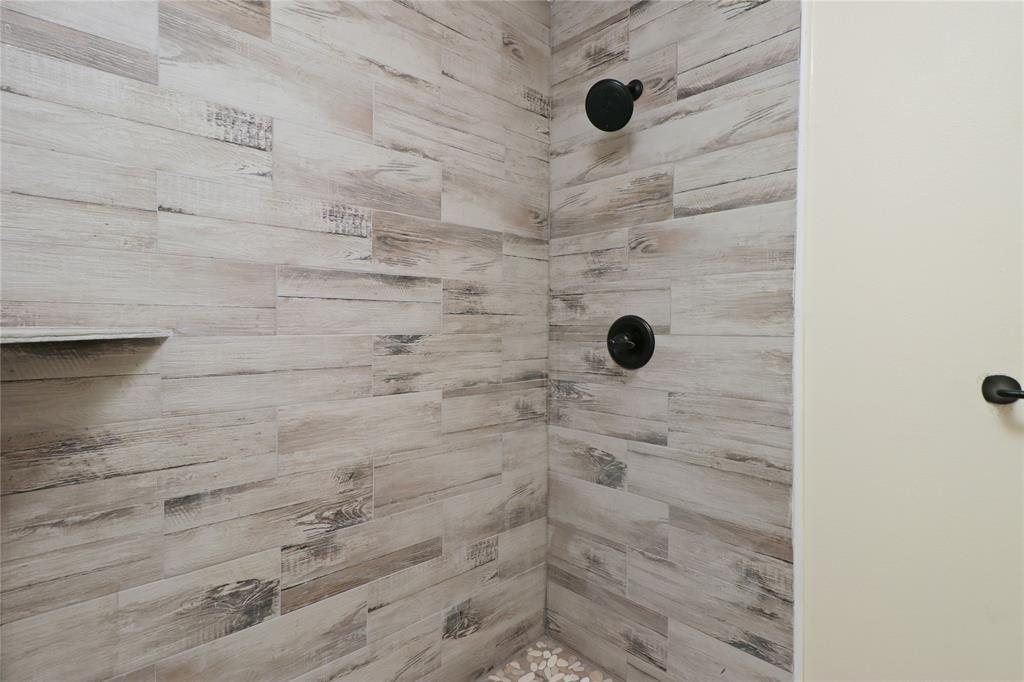 629 Edna Court Everman, TX 76140 - Photo 15 of 24 a bathroom with a shower