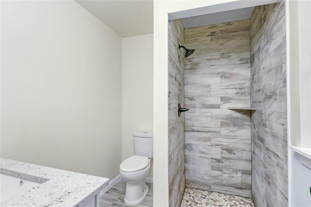 629 Edna Court Everman, TX 76140 - Photo 19 of 24 a bathroom with a toilet