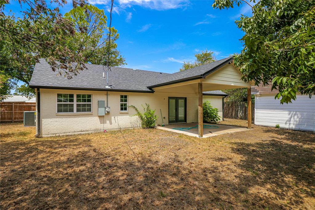 629 Edna Court Everman, TX 76140 - Photo 22 of 24 a front view of a house with a garden