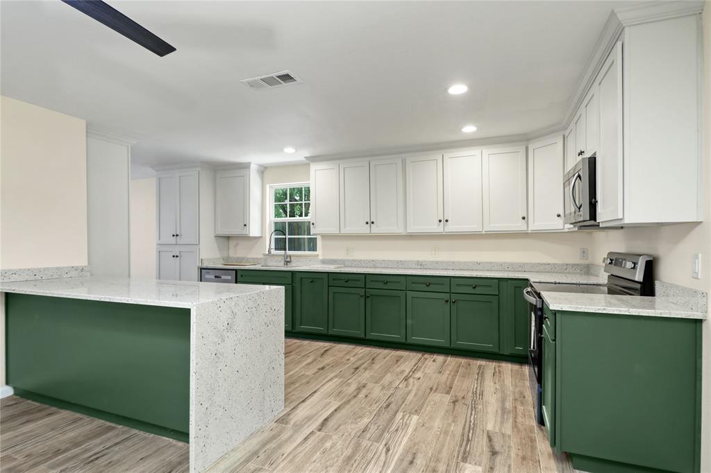 629 Edna Court Everman, TX 76140 - Photo 7 of 24 a kitchen with sink and cabinets