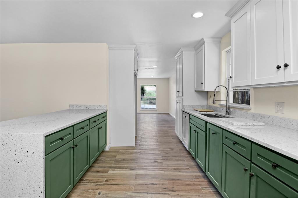629 Edna Court Everman, TX 76140 - Photo 9 of 24 a kitchen with a sink and cabinets