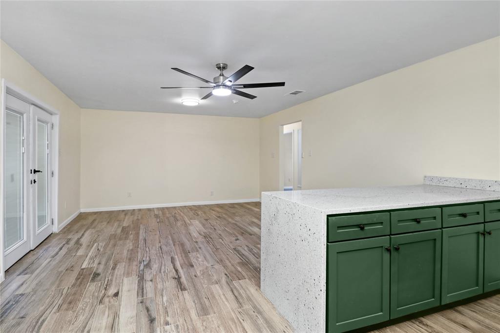 629 Edna Court Everman, TX 76140 - Photo 10 of 24 walk in closet with wooden floor