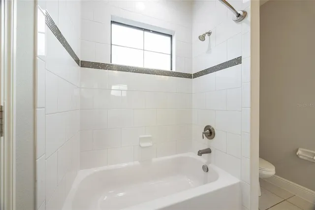 a bedroom with bed and window