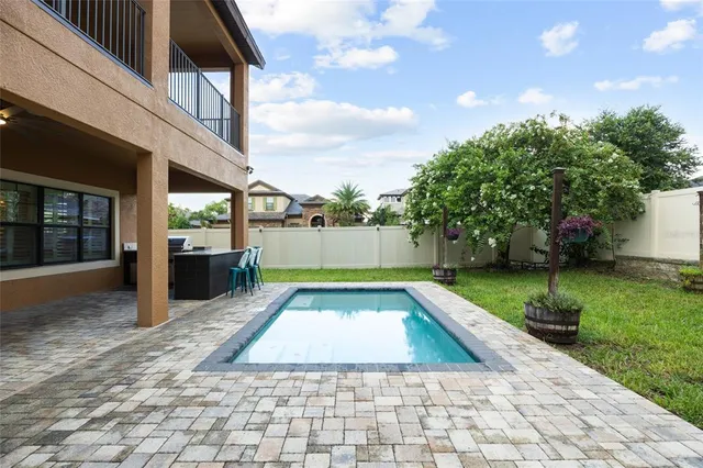 a view of open kitchen with a wooden floor and outdoor seating