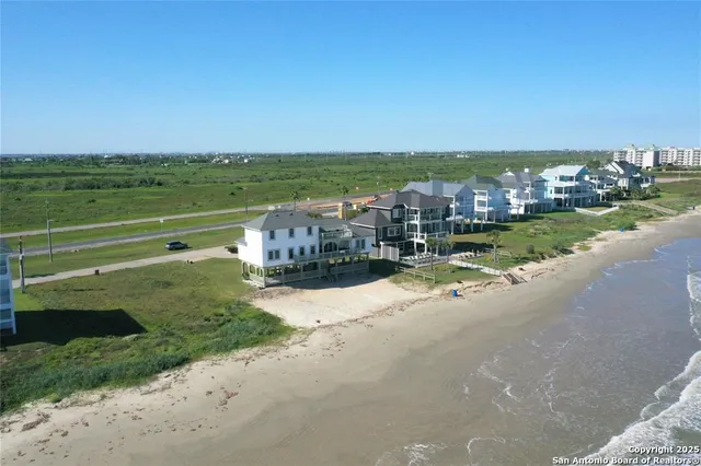 a view of ocean with wooden floor