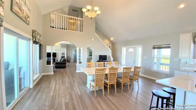 a bedroom with a bed a couch and a large mirror