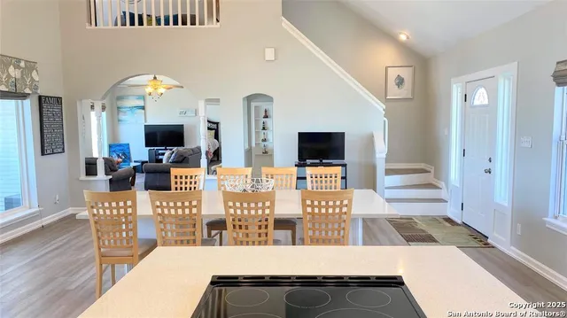a dining room with furniture and wooden floor