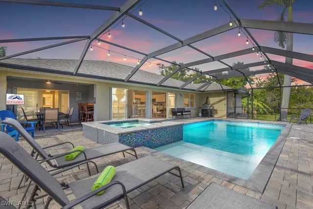 a view of swimming pool with outdoor seating