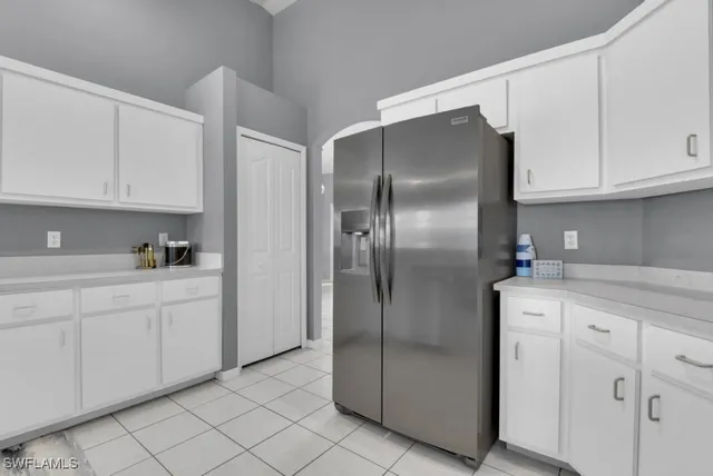 a kitchen with cabinets and stainless steel appliances
