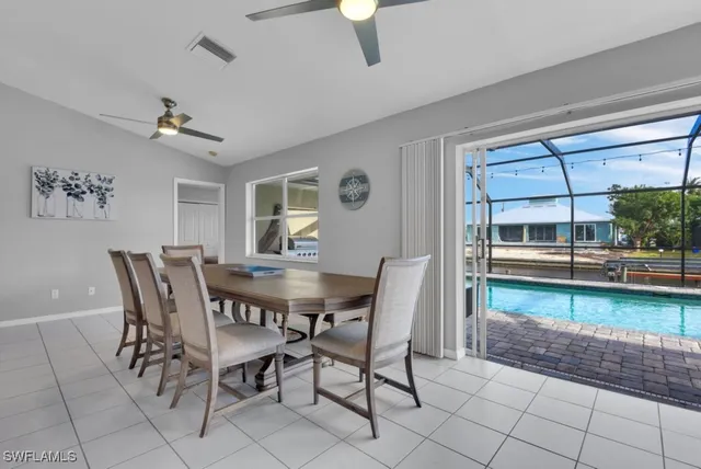 a view of a dining room with furniture and a rug
