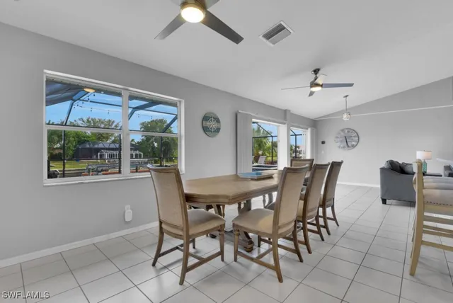 a view of a dining room with furniture and window
