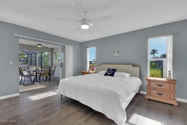 a bedroom with a bed a table and chair