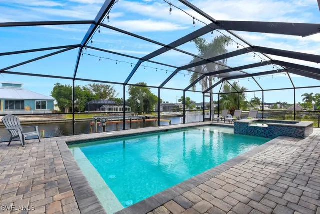 a view of a swimming pool with a patio