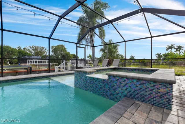 a view of swimming pool with a yard