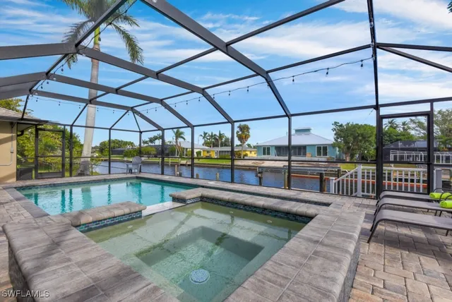 a view of a swimming pool with a patio