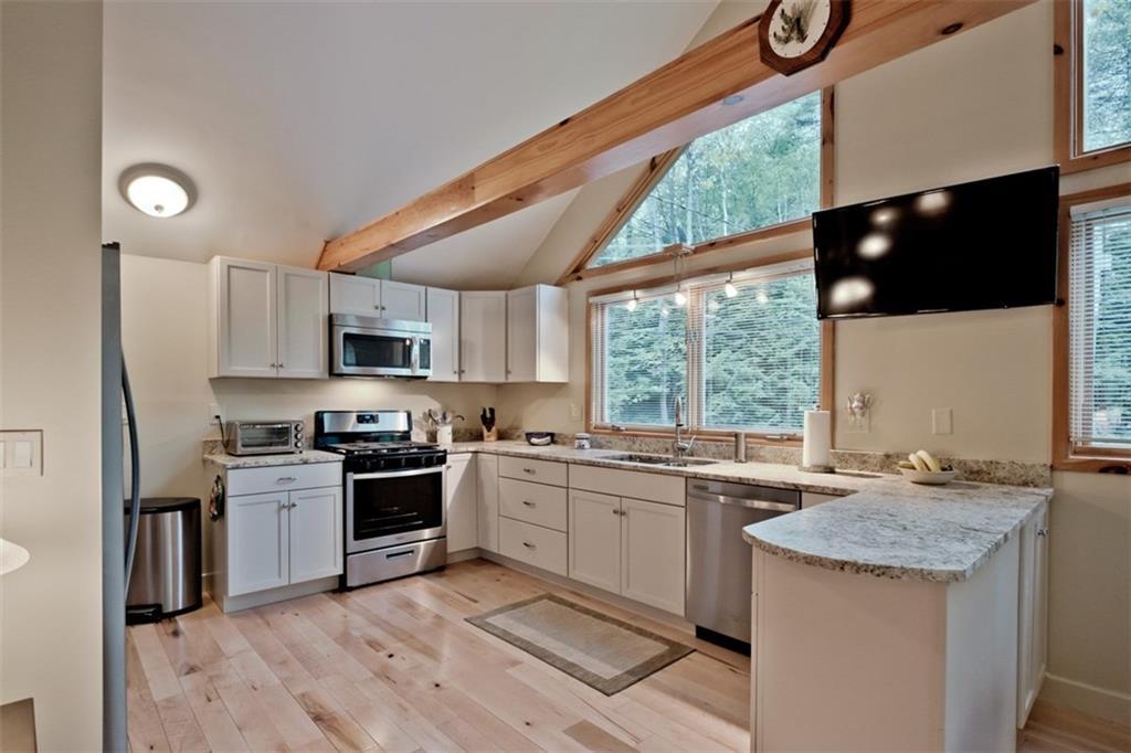 60 Mountain Road Bridgton, ME 04009 - Photo 12 of 35 The kitchen is bight and sunny with...