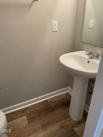 a bathroom with a sink and toilet