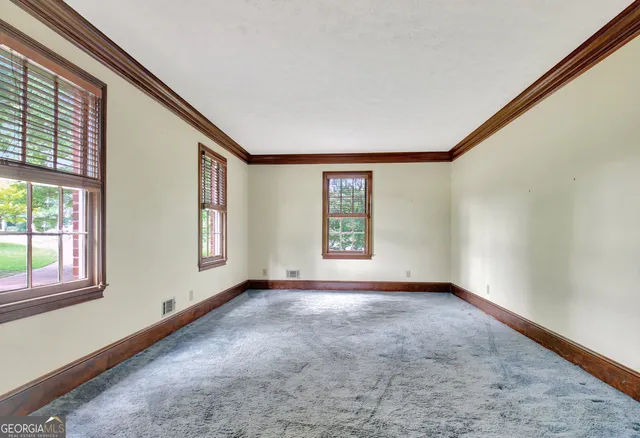 an empty room with windows