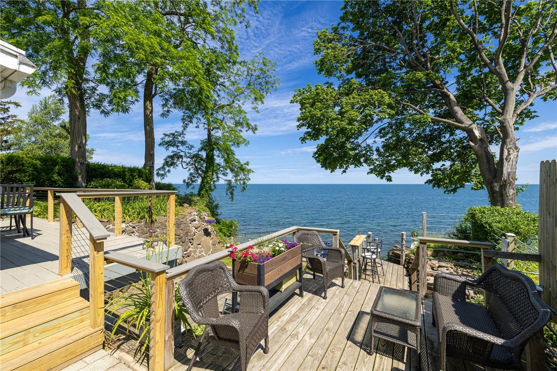 3183 Lake Road Williamson, NY 14589 - Photo 38 of 46 Lower deck with stairs leading to the backyard & p