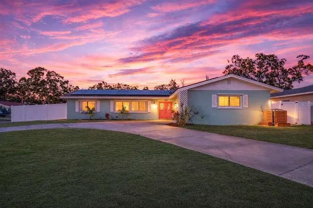 a view of a house with a big yard