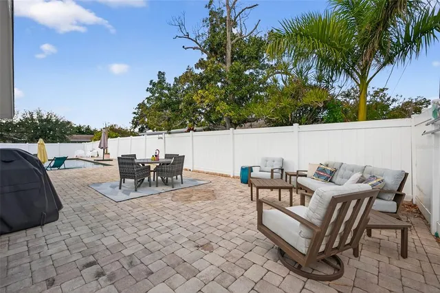 a view of a patio with a table and chairs