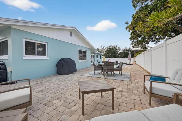 a view of a dinning table and chairs in the patio