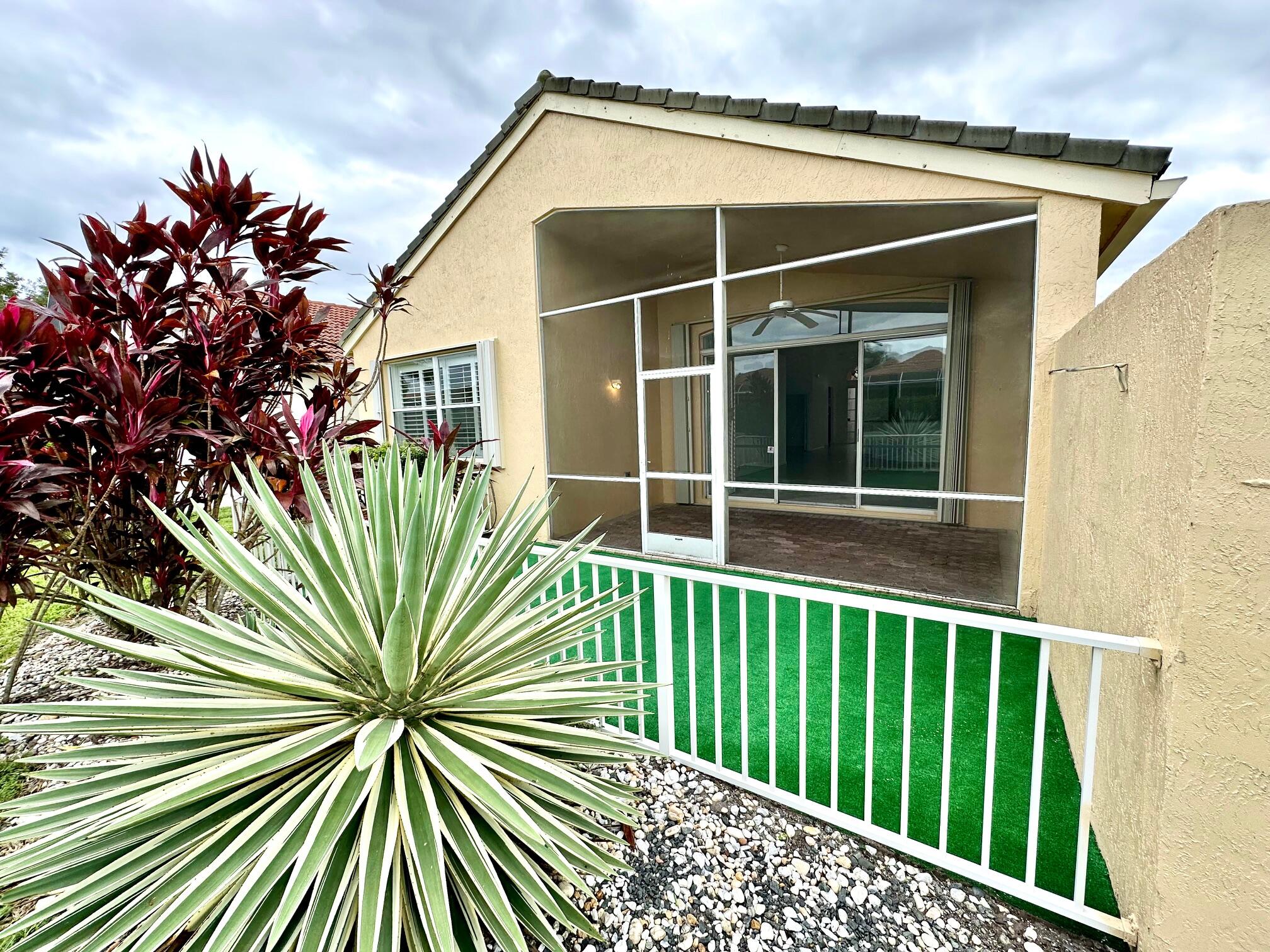 7096 Cataluna Circle Delray Beach, FL 33446 - Photo 22 of 32 a house view with a garden space