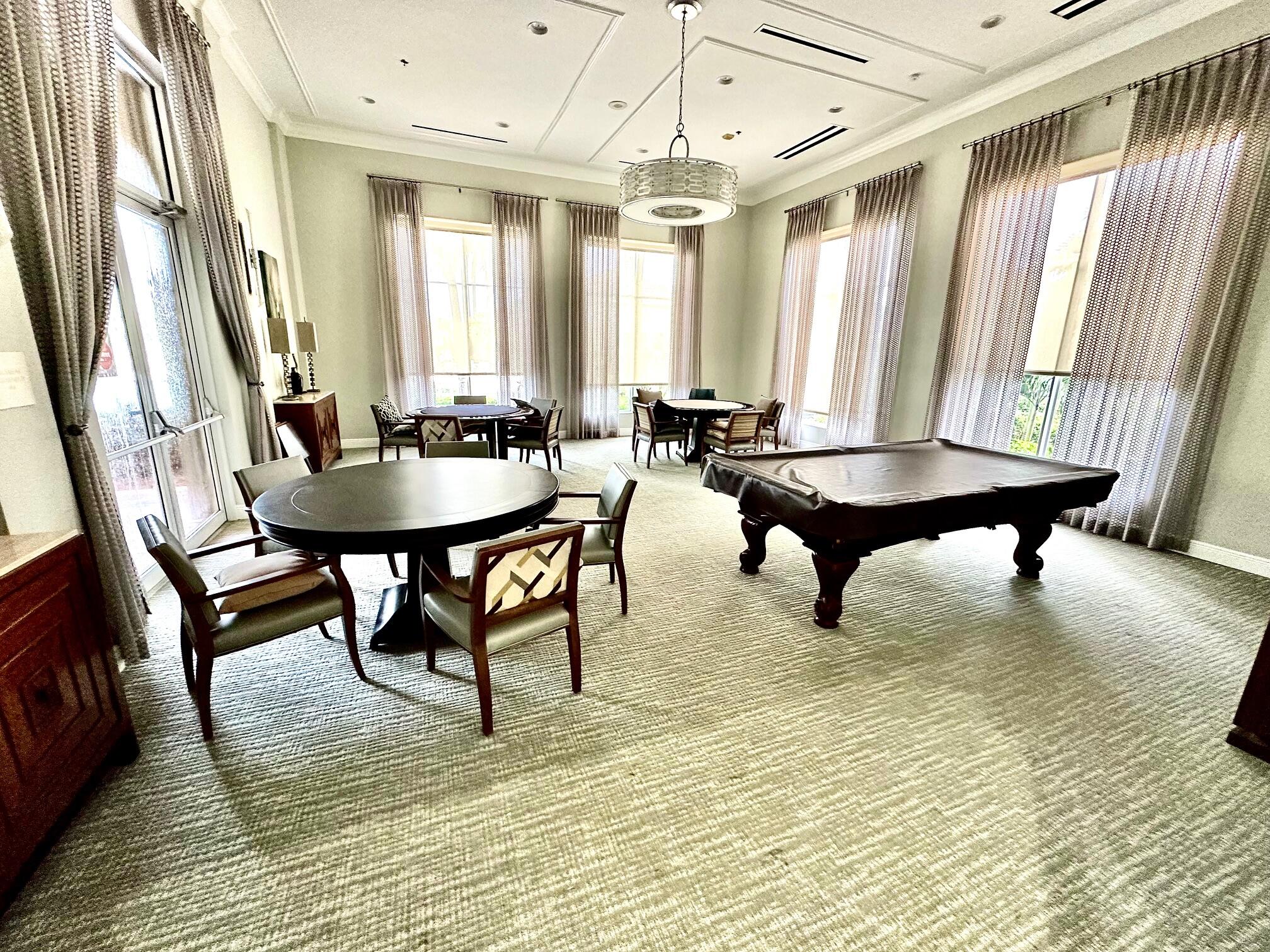7096 Cataluna Circle Delray Beach, FL 33446 - Photo 27 of 32 a living room with furniture and a large window