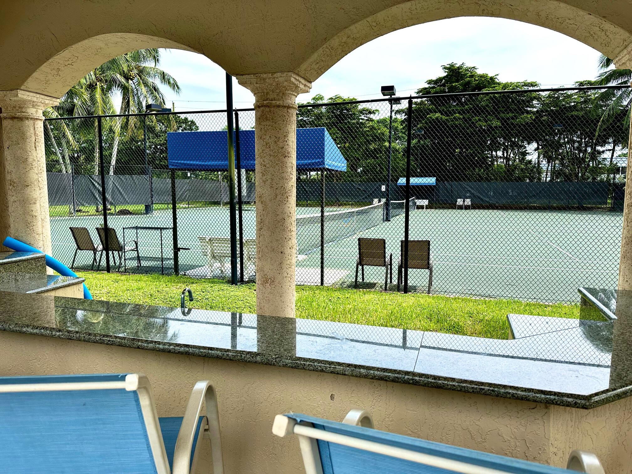 7096 Cataluna Circle Delray Beach, FL 33446 - Photo 28 of 32 a view of swimming pool with seating space