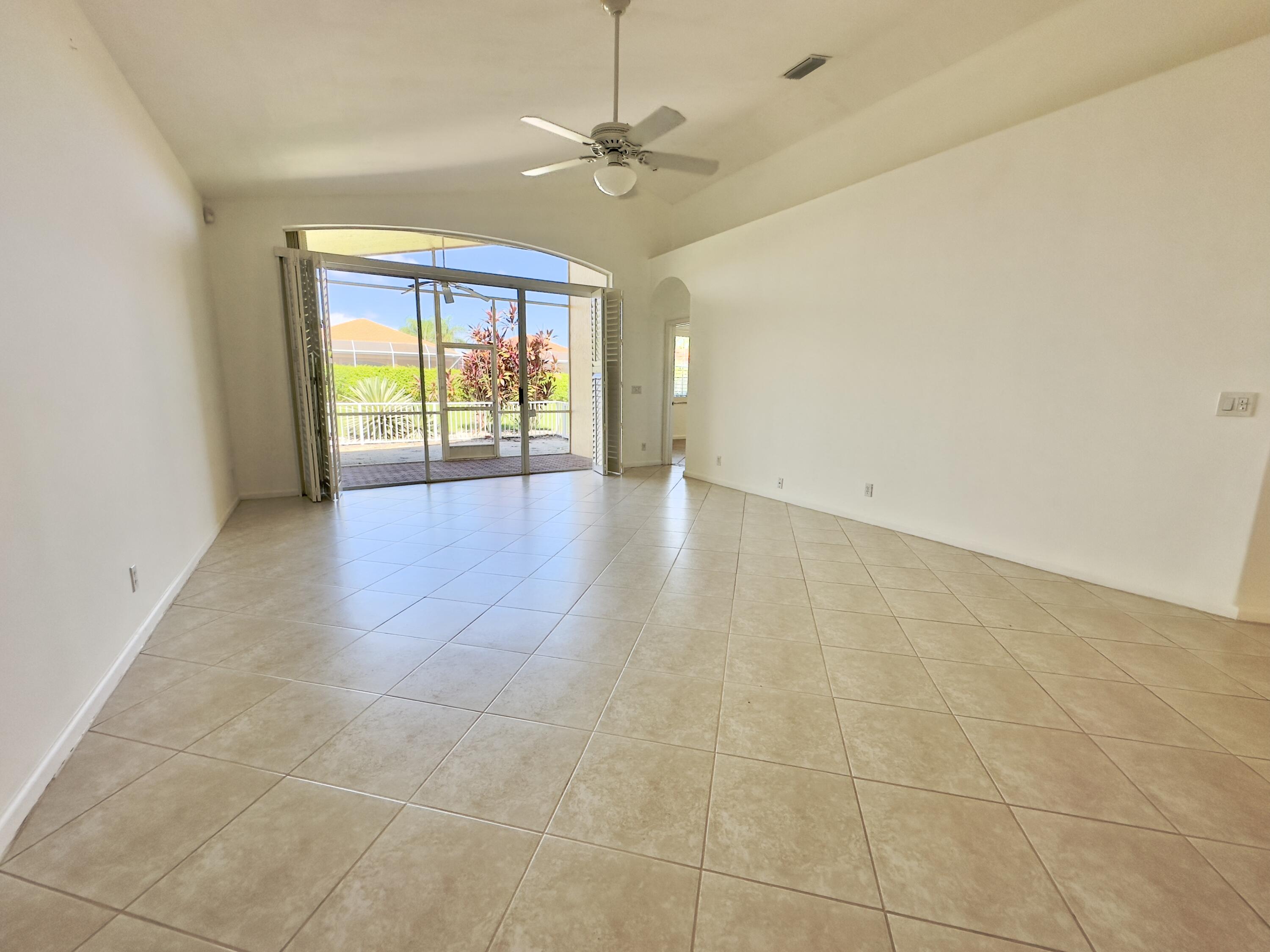 7096 Cataluna Circle Delray Beach, FL 33446 - Photo 7 of 32 a view of an empty room with a window