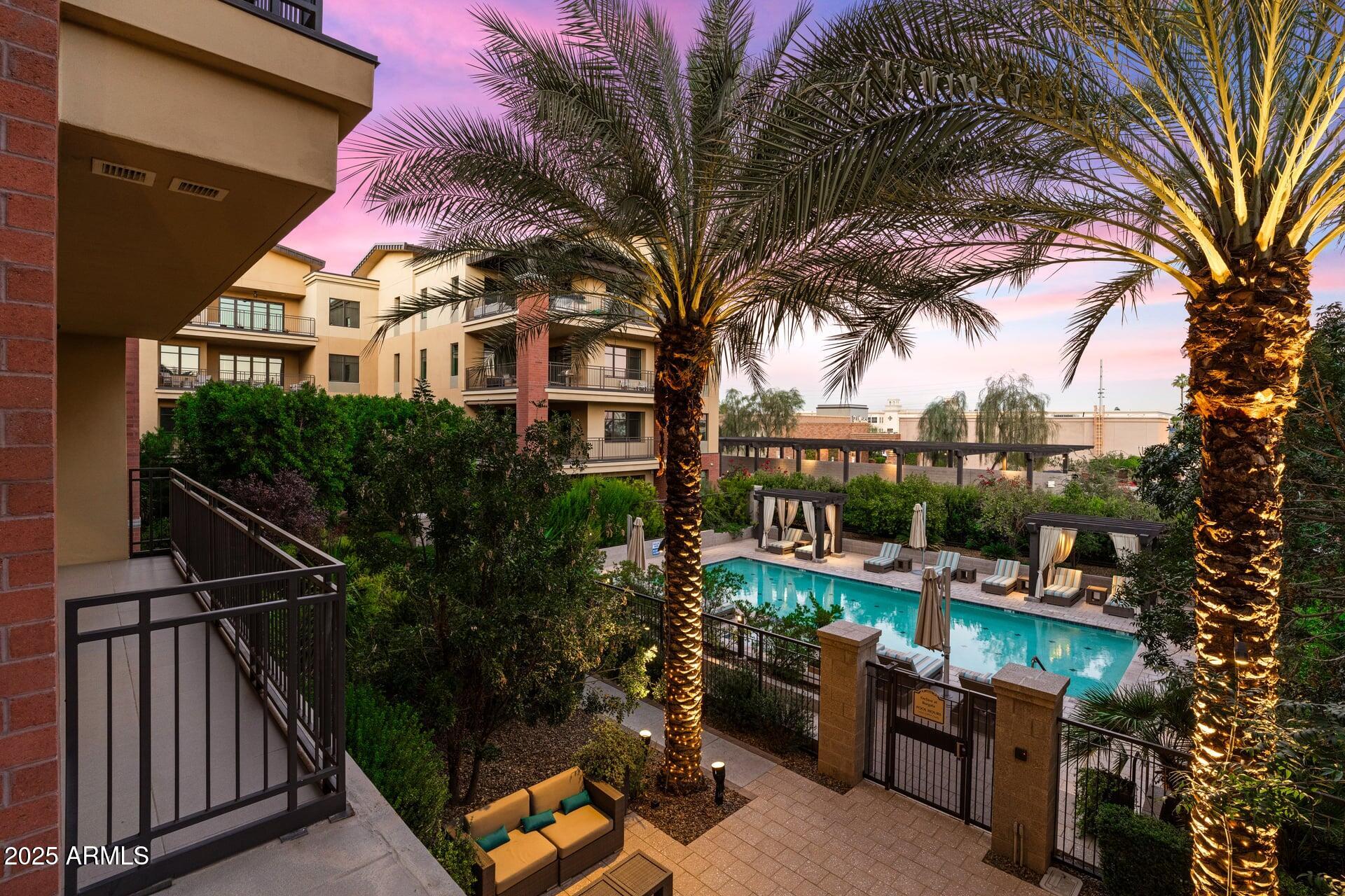 6166 North Scottsdale Road, Unit B2008 Paradise Valley, AZ 85253 - Photo 12 of 69 a view of a chairs and table in backyard of a house