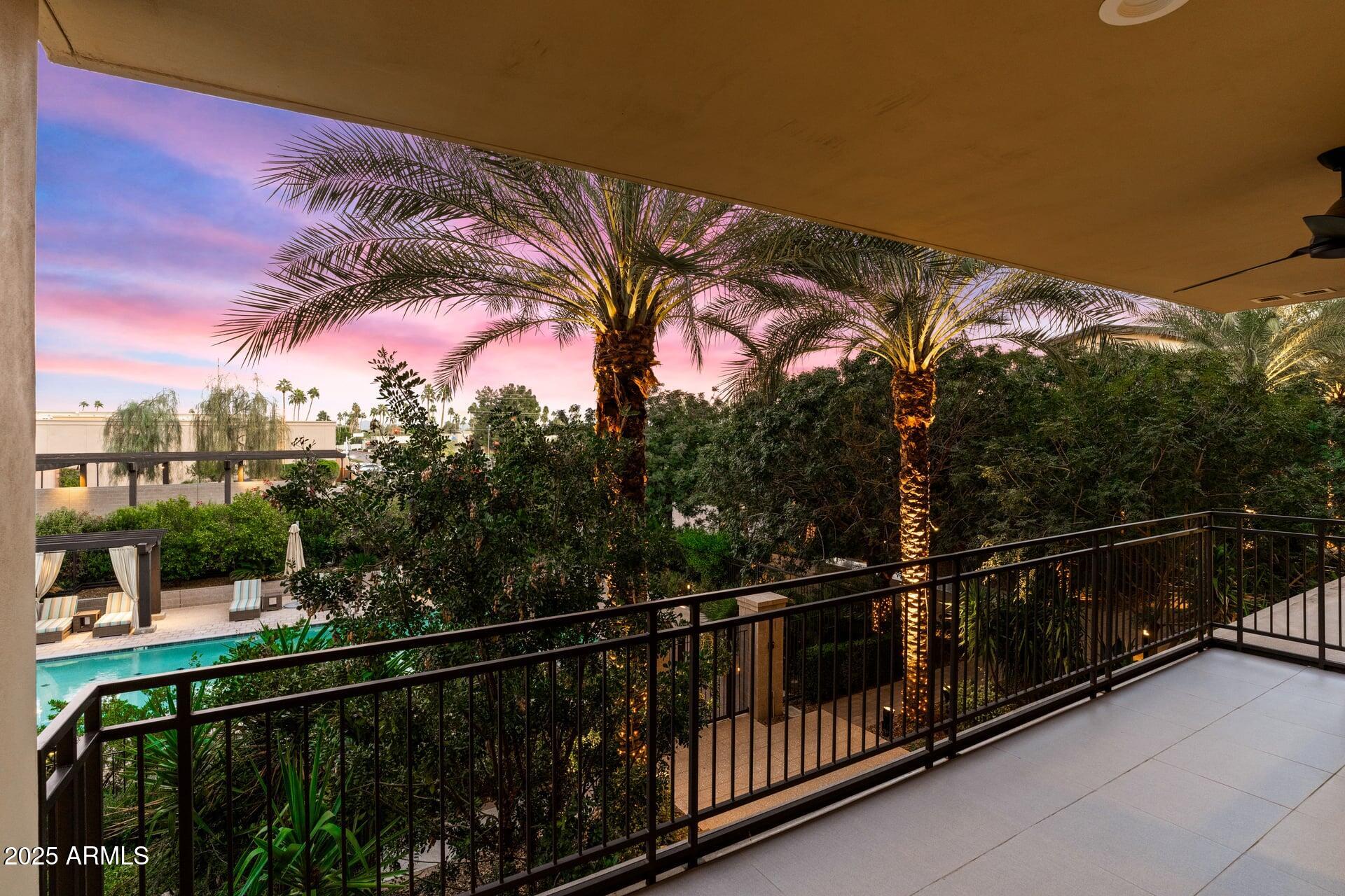 6166 North Scottsdale Road, Unit B2008 Paradise Valley, AZ 85253 - Photo 13 of 69 a view of a balcony with a floor to ceiling window and wooden fence